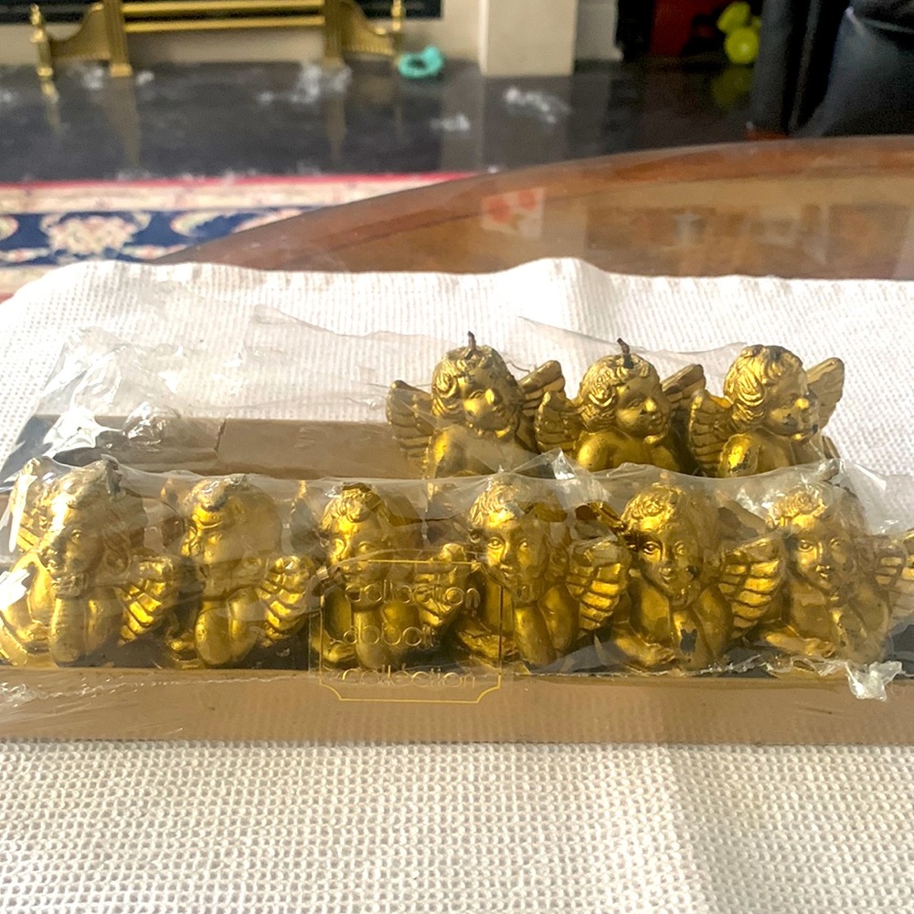 New in box gold cherub tea candles. Set of 6 +3